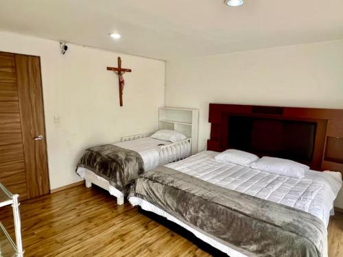 Ένα ή περισσότερα κρεβάτια σε δωμάτιο στο Casa Galerias Serdan II