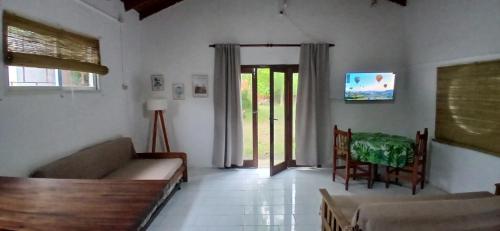 a living room with a couch and a table at Chalet La Gran Familia in San Bernardo
