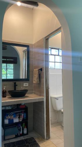 a bathroom with a sink and a toilet at Finca Buenavista Sasaima in Sasaima