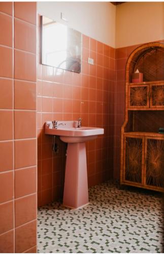 a bathroom with a sink and a mirror at Bega Grand Hotel in Bega