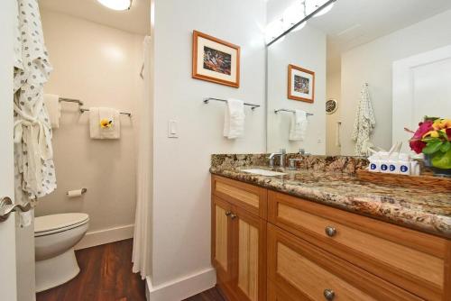 a bathroom with a sink and a toilet at Napili Shores F246 · NS F246 Spacious Condo w Pools AC Near Napi in Kahana