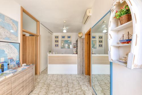 a bathroom with a tub and a sink in a room at Residence Trande a Leuca in Marina di Leuca