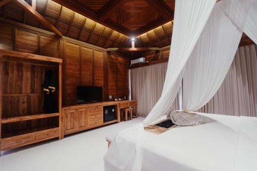 Ένα ή περισσότερα κρεβάτια σε δωμάτιο στο Padi Bali Villa