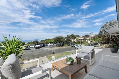 a patio with a view of a parking lot at Thalassa Views Ulladulla in Ulladulla