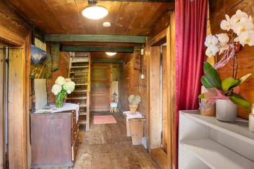 a hallway of a tiny house with wooden walls at Oberlehen Hof in Rohrberg