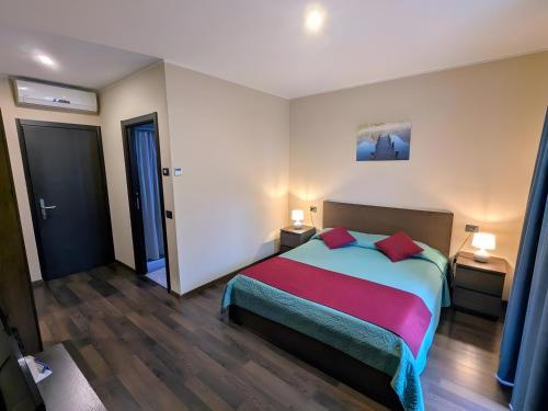 Postel nebo postele na pokoji v ubytování Foresteria - bb Sul Lago