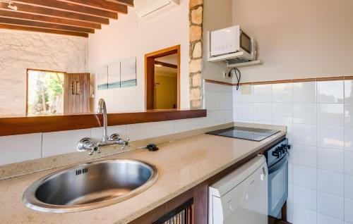 a kitchen with a sink and a counter top at Cala Deia in Deia
