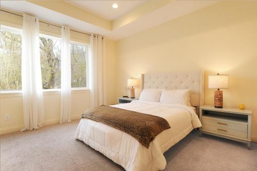 a bedroom with a large bed and a window at New home with all the modern comforts 