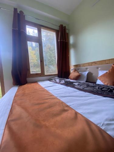 Ένα ή περισσότερα κρεβάτια σε δωμάτιο στο The Spiritual Cafe