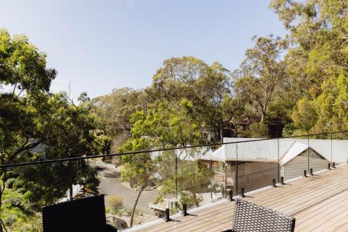 a view from the deck of a house with trees at Parachilna at Boardwalk Villas Metung in Metung