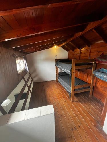 an attic room with two bunk beds in it at Tu lugar en Santa Clara in Santa Clara del Mar