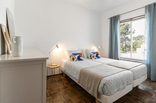Postel nebo postele na pokoji v ubytování Casa da Lua