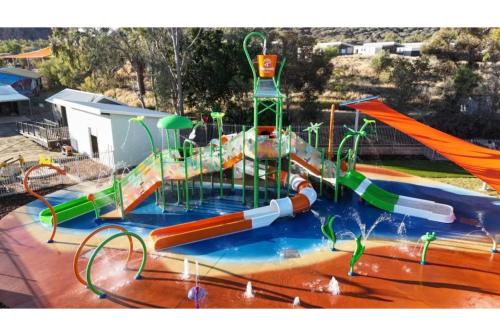 a large water park with a water slide at Discovery Parks - Alice Springs in Alice Springs
