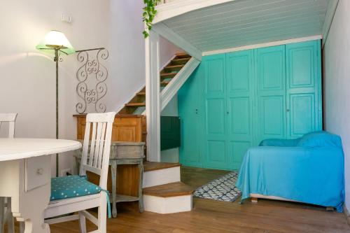 a room with a bed and a staircase at Casa del Pescatore in Piombino