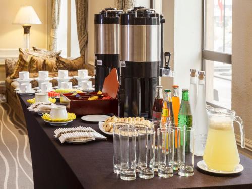 a table with food and drinks on top of it at Hotel Regal Pacific Santiago in Santiago