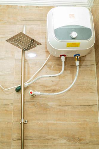 a machine on the floor with a blood pressure gauge at Soothing Haven in Ibadan