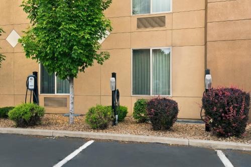 a building with parking meters in front of a building at Oxford Suites Spokane Downtown in Spokane