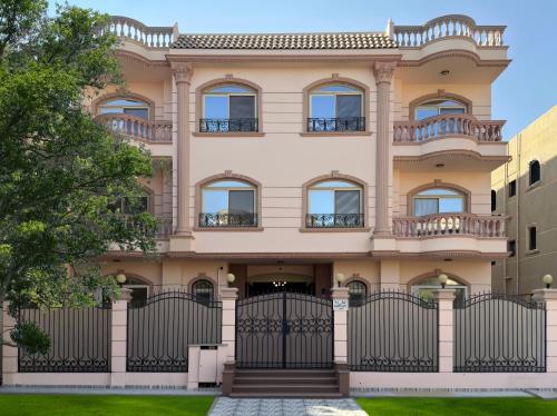 a house with a gate in front of it at 利恩之家 埃及会展中心 in Cairo