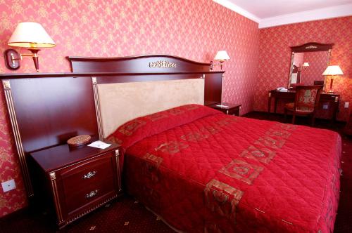 Кровать или кровати в номере White House Hotel