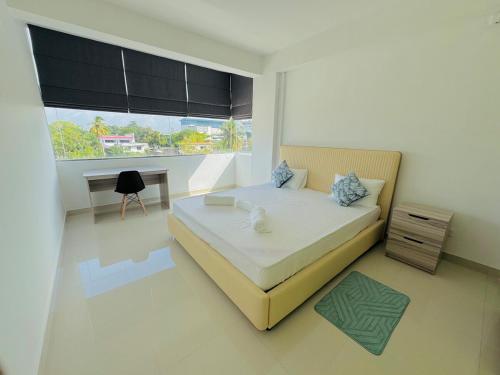 Ένα ή περισσότερα κρεβάτια σε δωμάτιο στο The Colombo Charm