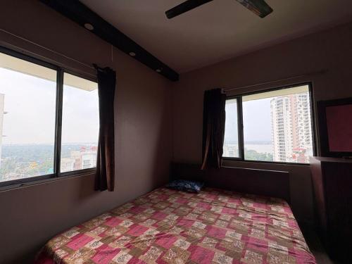 Postel nebo postele na pokoji v ubytování By the Ganges