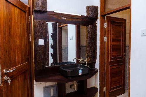 Ένα μπάνιο στο Savannahs Kunduchi Villa