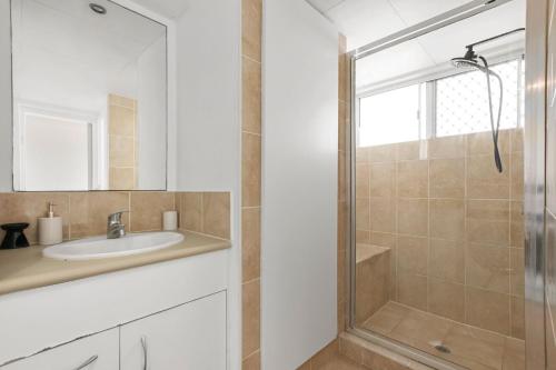 a bathroom with a sink and a shower at Kailoha Unit 8, 27 Canberra Tce, Kings Beach in Caloundra