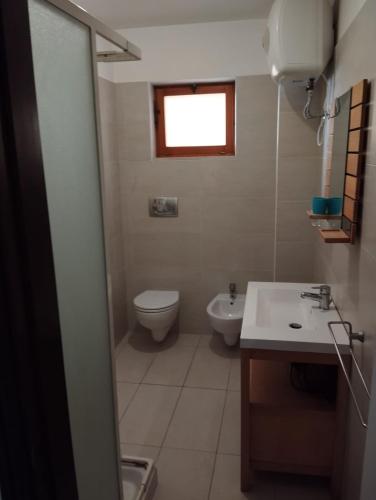 a bathroom with a toilet and a sink at Al Castello 2 in Bari