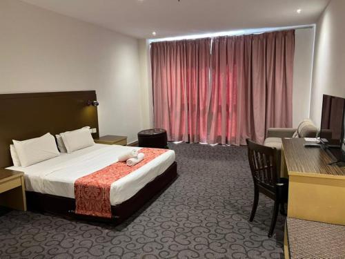 Postel nebo postele na pokoji v ubytování Kingston Hotel 15 - Tower Regency, Ipoh