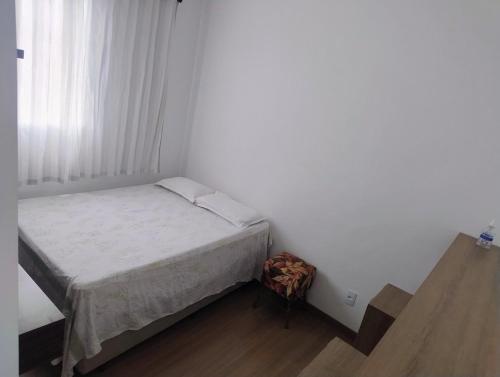 En eller flere senge i et værelse på Apto inteiro 600mts do Hospital de Amor