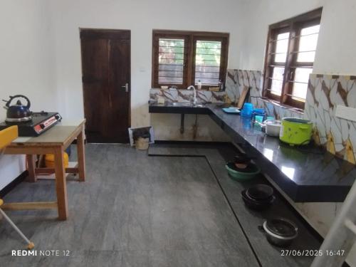 a kitchen with a counter top in a room at Randuli Holiday Homes in Anuradhapura