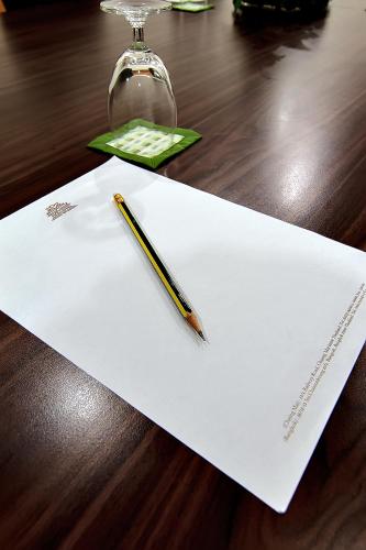 a pencil sitting on a piece of paper on a table at Bossotel Bangkok in Bangkok