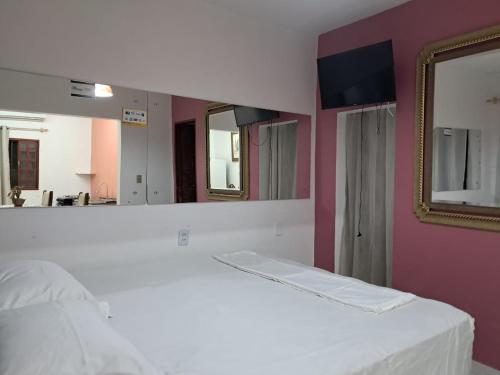 Ένα ή περισσότερα κρεβάτια σε δωμάτιο στο kitnet Ceu