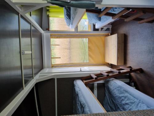 a small room with a window and two chairs at Floss Priepert 1 in Priepert