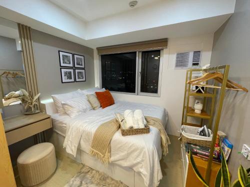 Ένα ή περισσότερα κρεβάτια σε δωμάτιο στο Emetheria Residence CDO