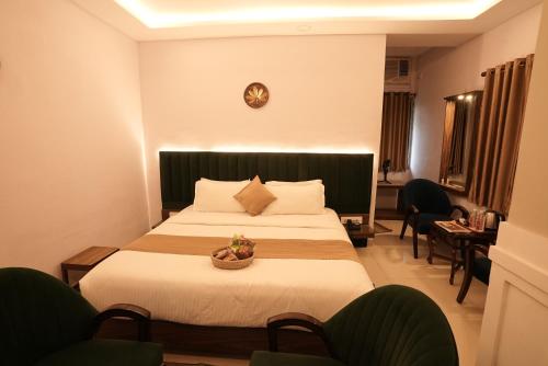 Postel nebo postele na pokoji v ubytování Utsav Hotels and Banquets Bolpur