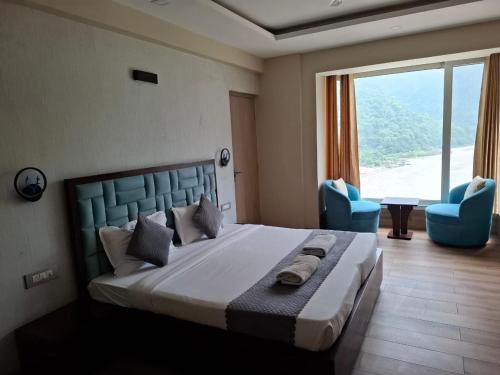 Postel nebo postele na pokoji v ubytování Luxury Aloha Apartments, Rishikesh