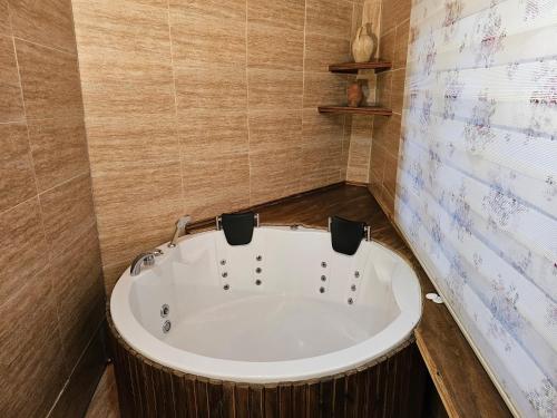 a bathroom with a bath tub in a room at Glorious House Goreme in Nevsehir
