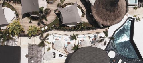 an overhead view of a resort with a swimming pool at Runik Beach Club & Resort - Adults Only in Siquijor