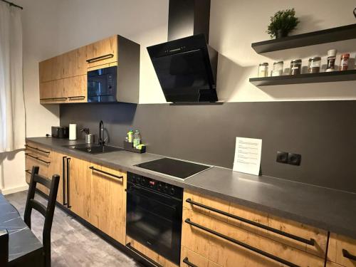 a kitchen with a sink and a stove at Eigentumswohnung in Dresden in Dresden