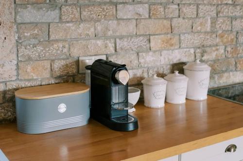 a coffee maker sitting on top of a counter at Riglia Villas - Villa Stone in Riglia