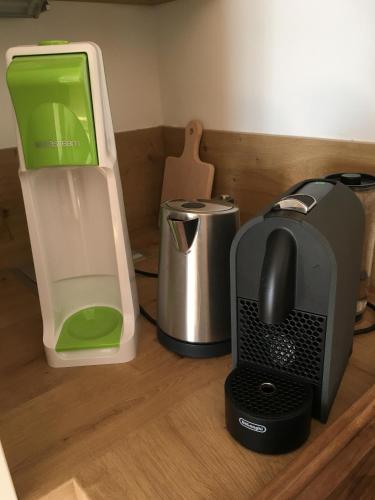 a desk with a computer and a printer and a toaster at Appartement Hauser Kaibling in Haus im Ennstal