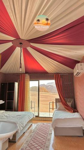 a bedroom with a tent with a bed and a window at Camp tala moon in Disah