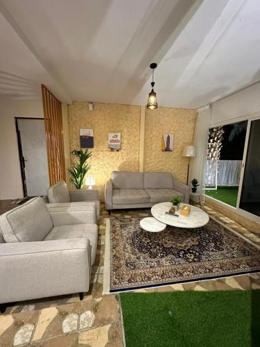 a living room with a couch and a table at بلكونه 7 in Taif