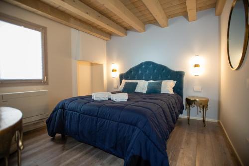 Ένα ή περισσότερα κρεβάτια σε δωμάτιο στο CA' del SAL LUXURY APARTMENTS