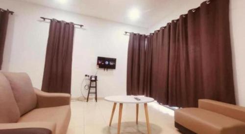 Posezení v ubytování OYO 90507 Chalet Sumayyah