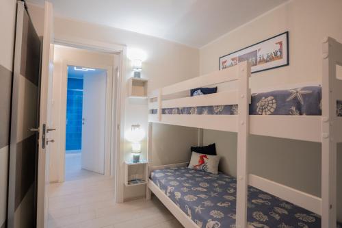 En eller flere senge i et værelse på Villa Liliana - Ancora - Esclusivo con Accesso Diretto alla Spiaggia