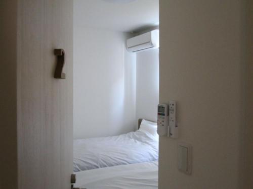 a door leading into a bedroom with a bed at Building A - Vacation STAY 72692v in Kikuchi