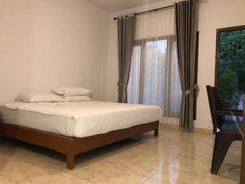 Postel nebo postele na pokoji v ubytování Sisilia Lodge