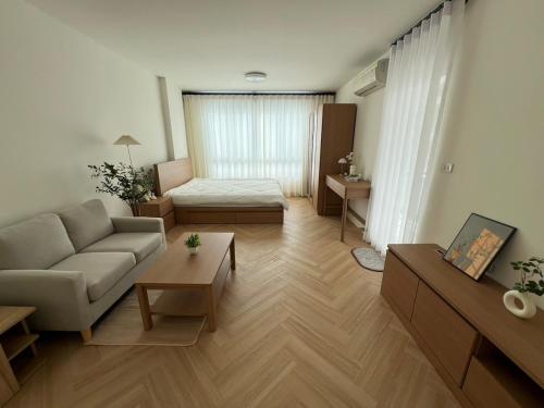 Ένα ή περισσότερα κρεβάτια σε δωμάτιο στο Minimal Condo At Ramkhamhaeng 64